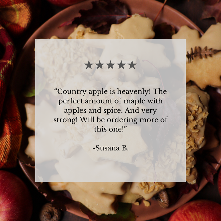 A square white review card with a five-star rating and a customer quote from Susana B., placed over a styled flat-lay of apple-shaped cookies on a plate with apples and autumn leaves around it.
